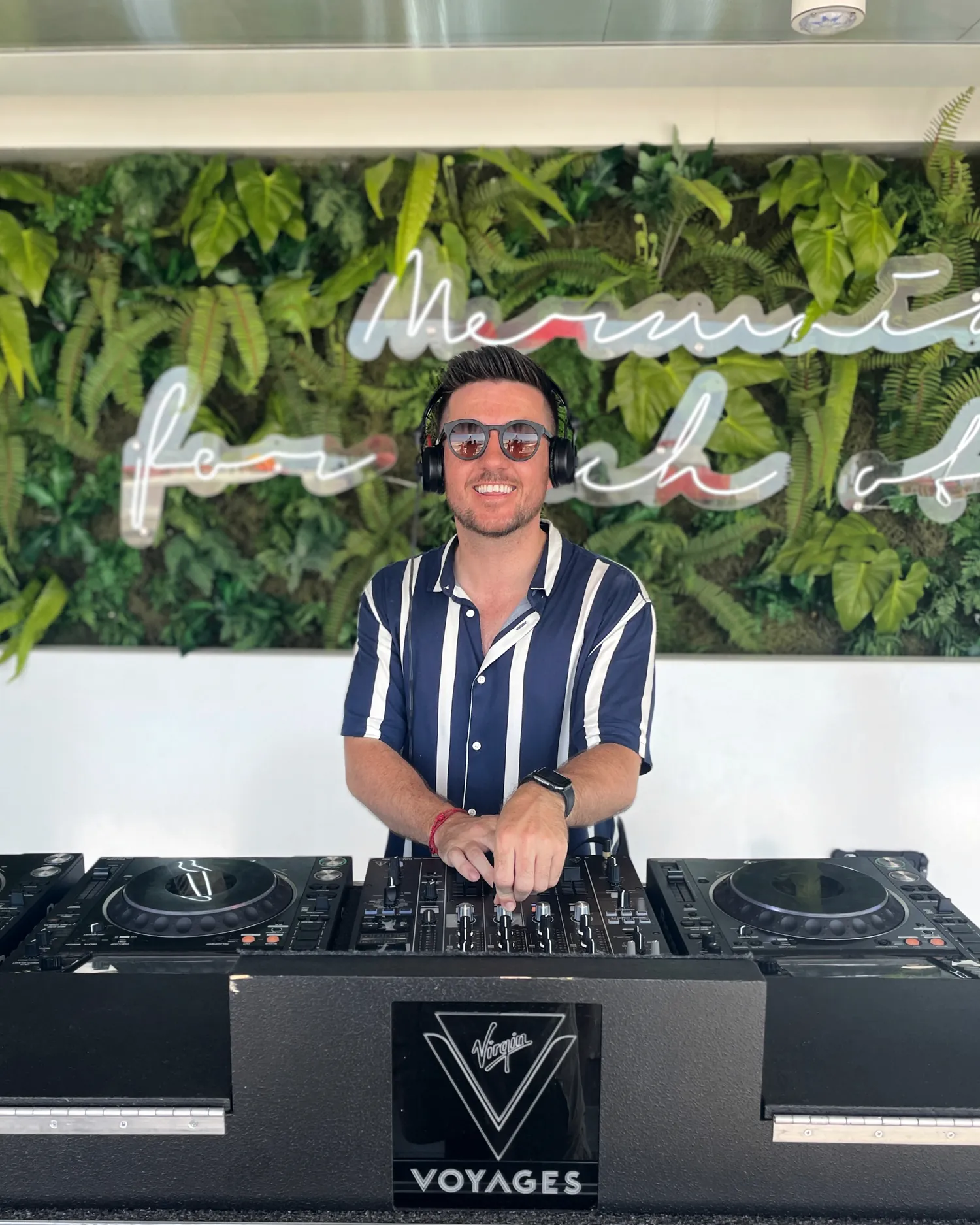 James Campbell DJing on a cruise deck